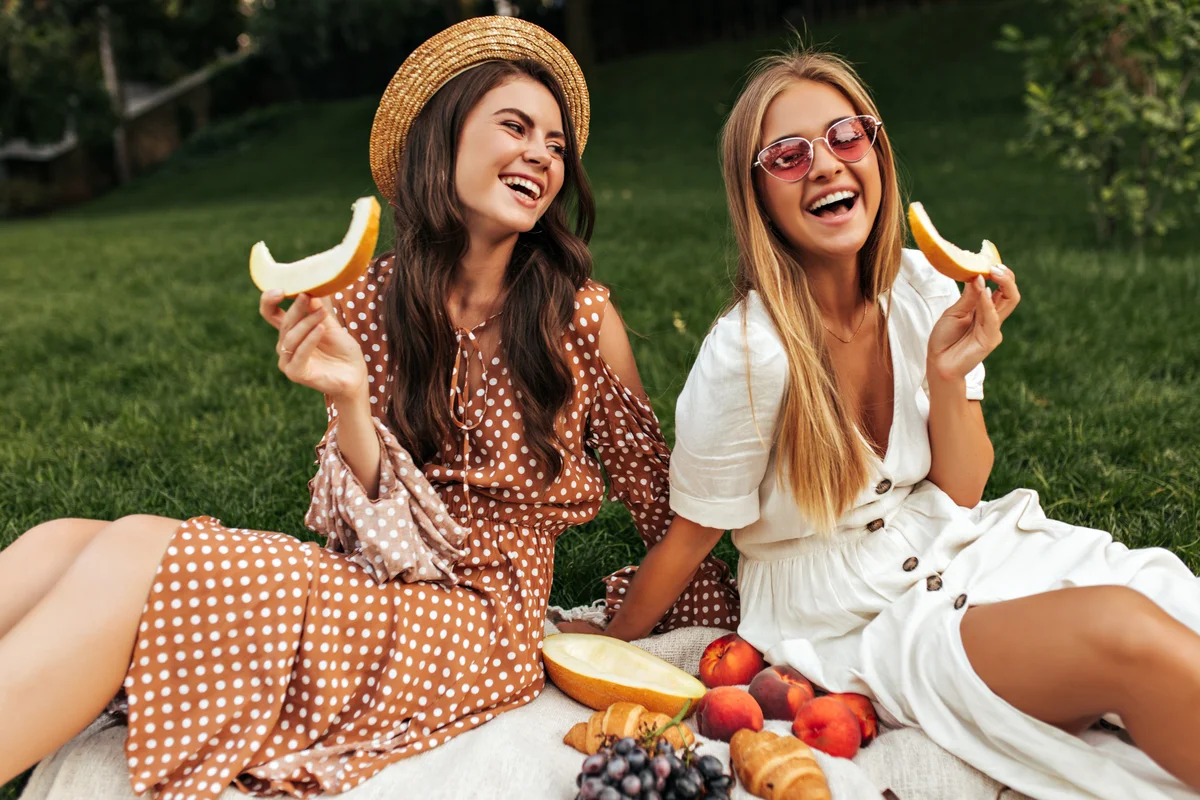 Women picnic in backyard