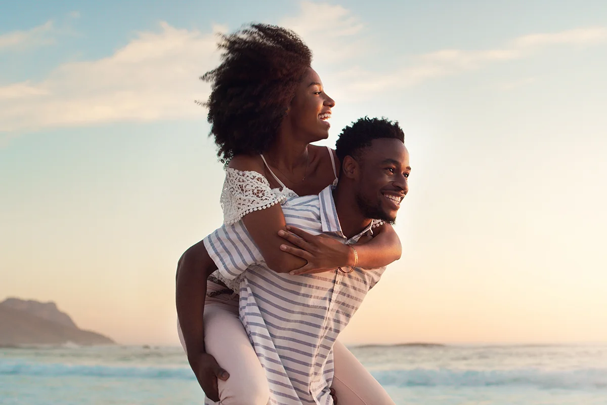 Couple at the beach smiling