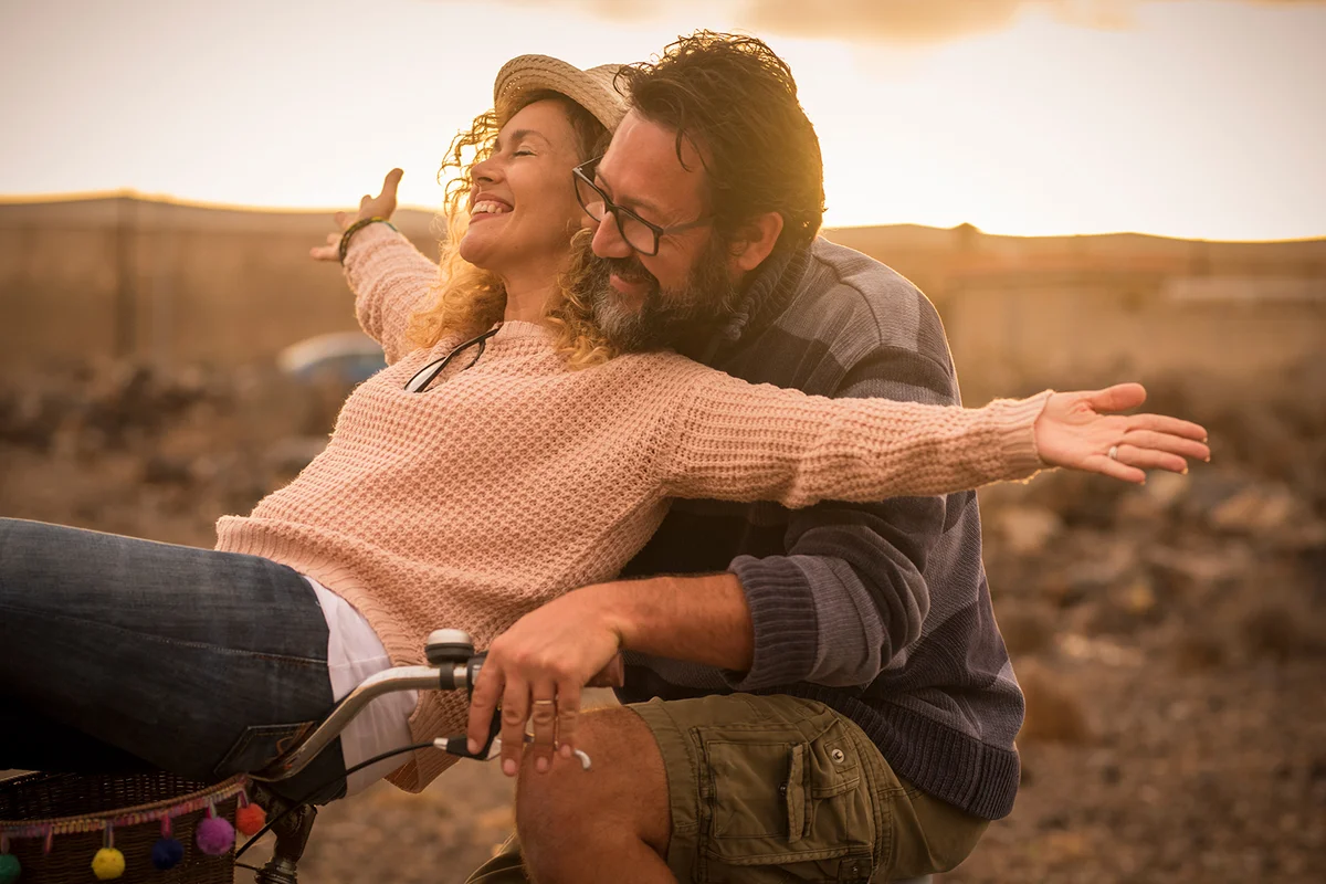 Couple outdoors on bike