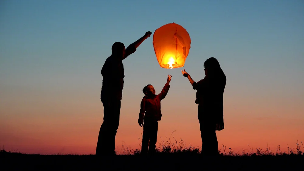 Family releasing sky lantern