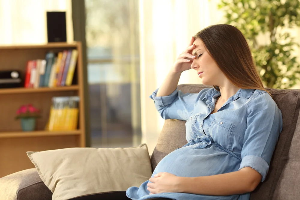 Pregnant woman suffering from a headache