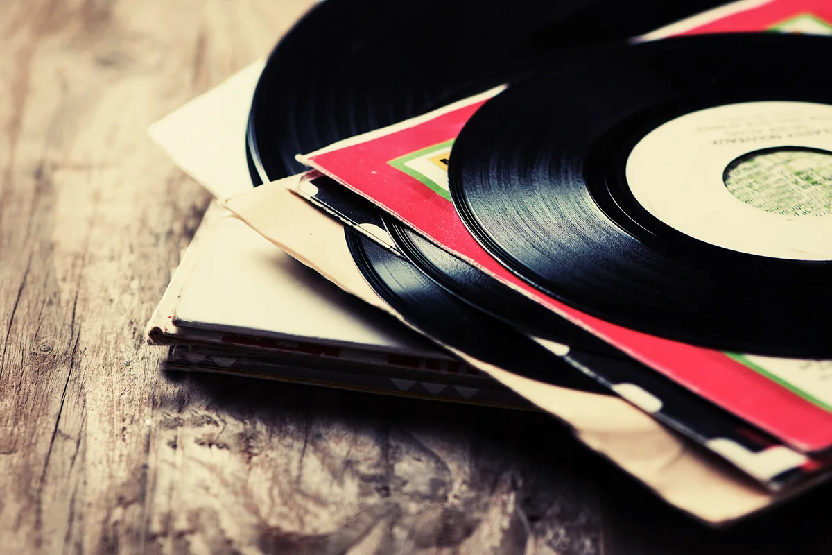 Old vinyl record on the wooden table