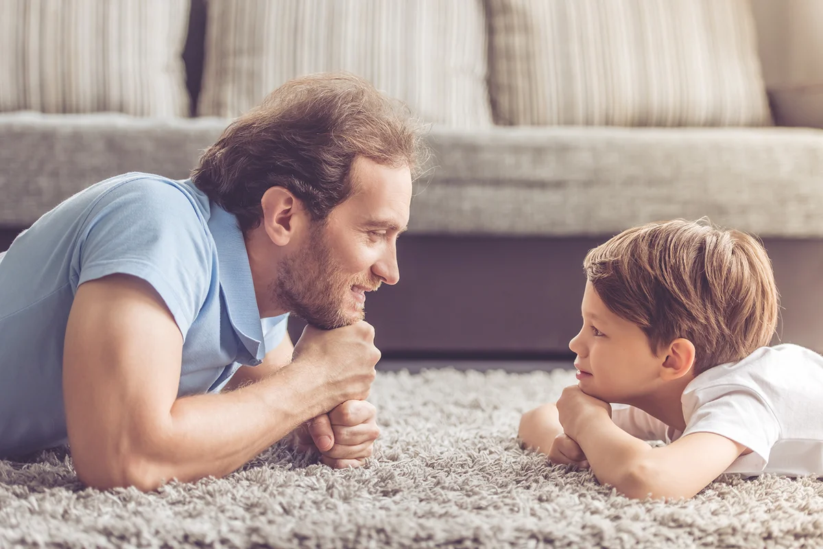 Son and dad on carpet
