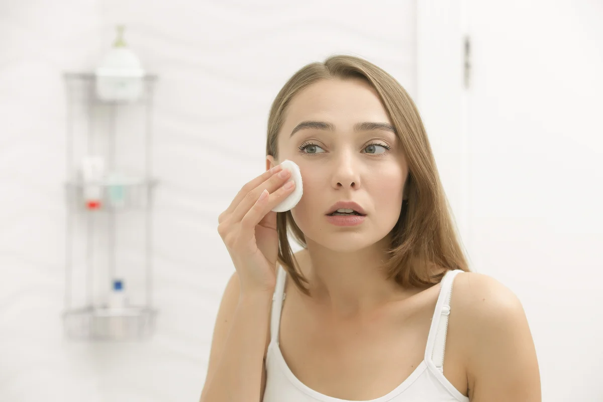 Woman cleaning makeup