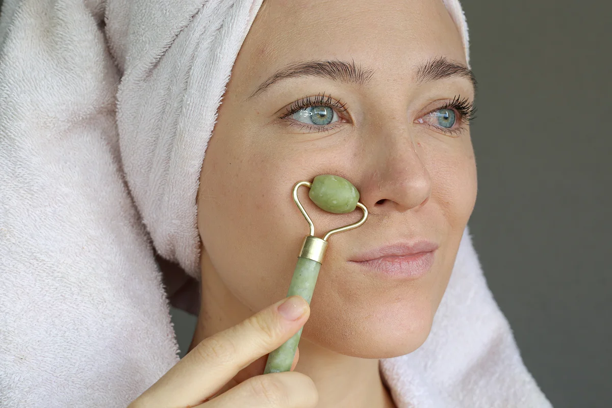 woman using Jade Eye-Roller