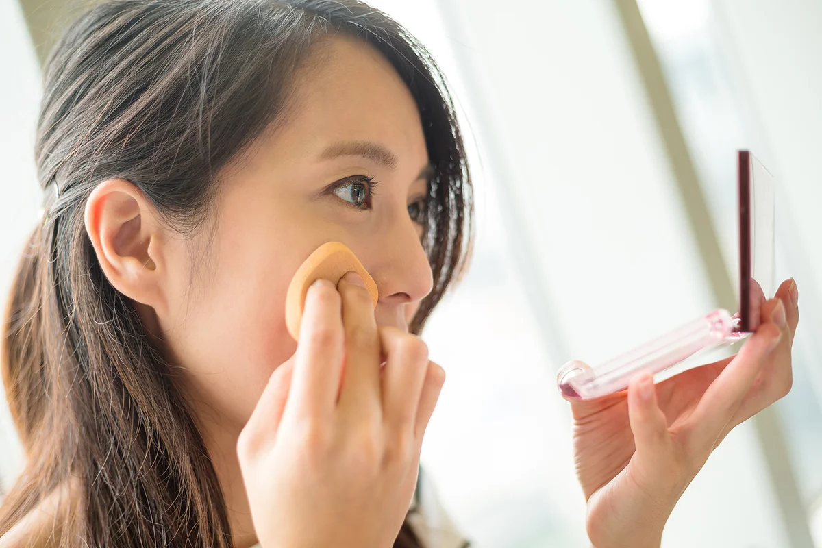 Woman powdering her nose