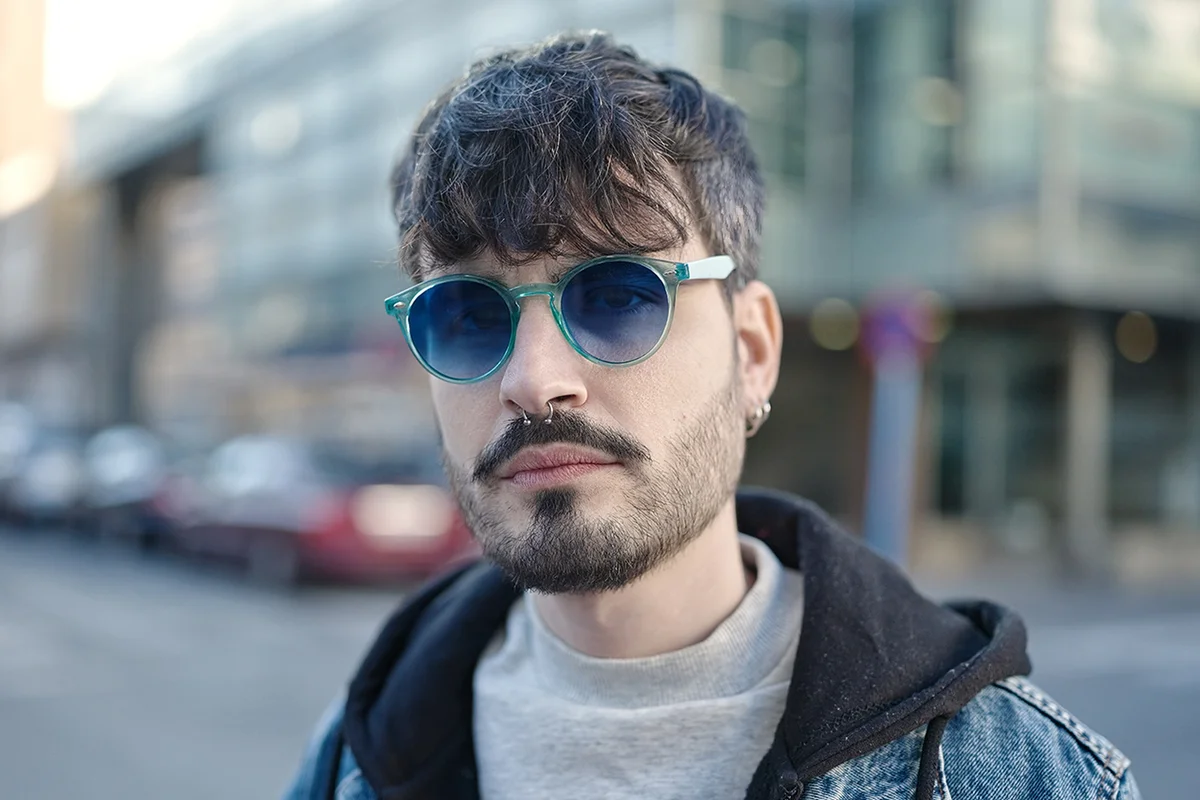 Man wearing blue sunglasses