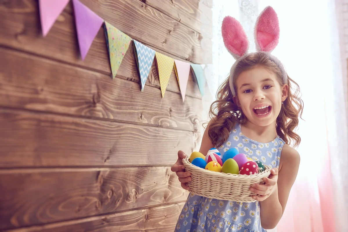 Cute little child wearing bunny ears on Easter day