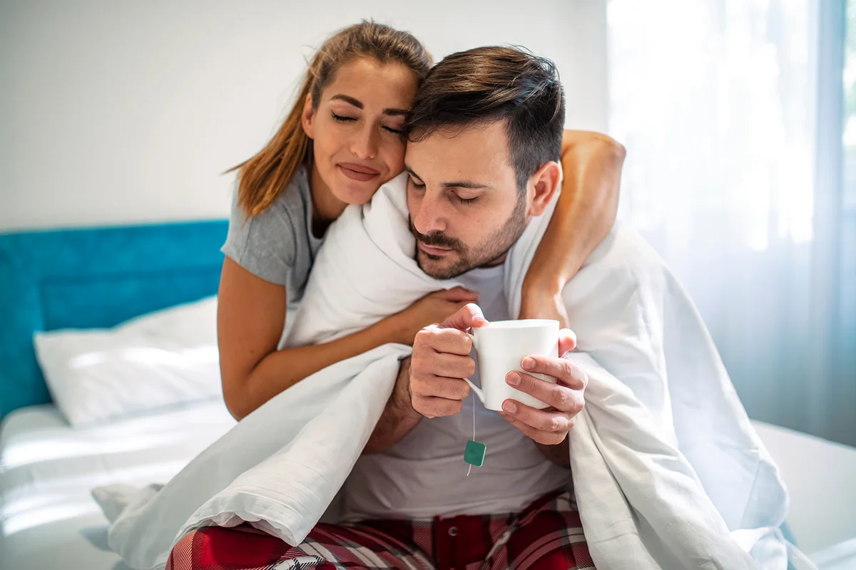 Young wife taking care of sick husband