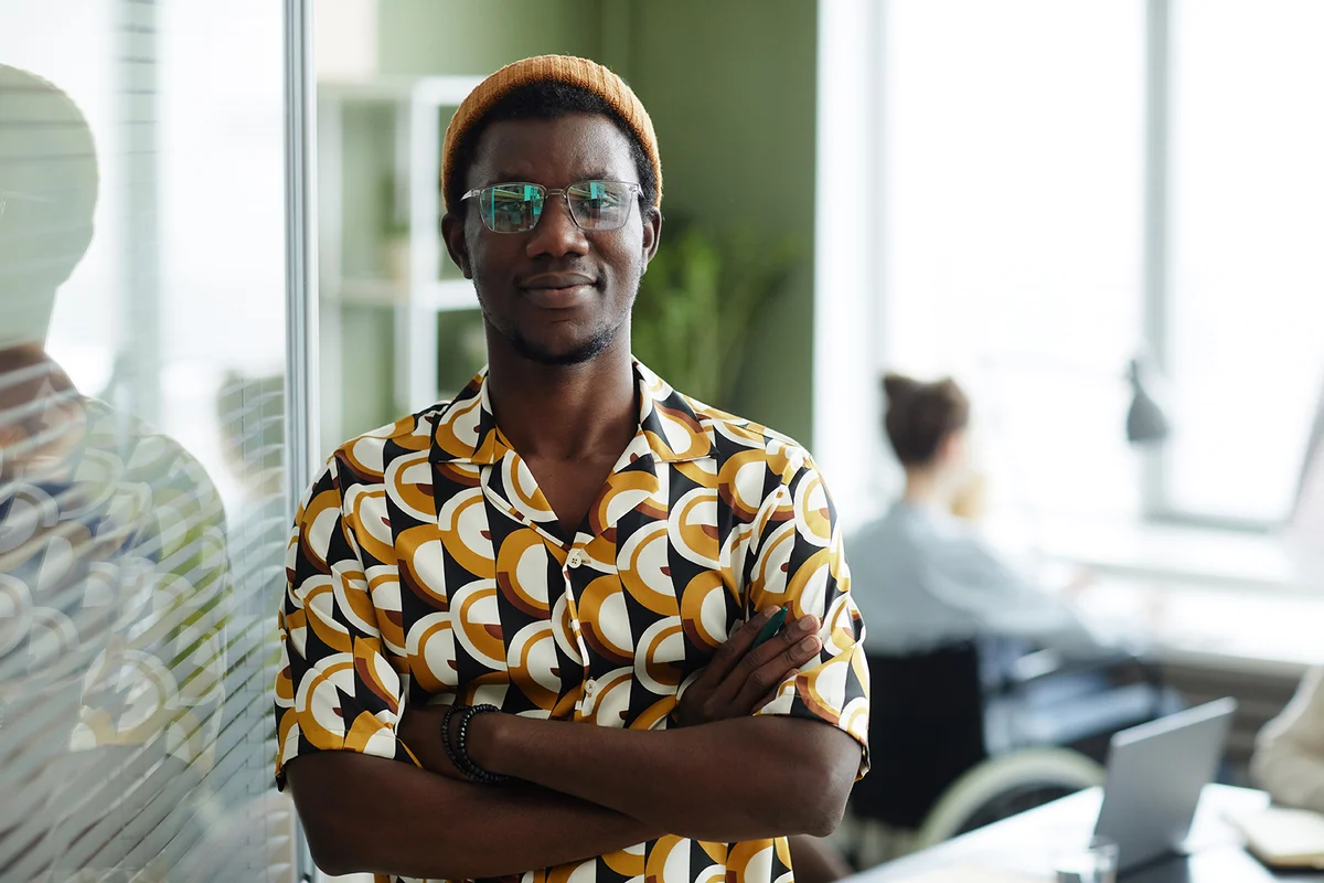 young man wearing bright yellow pattern in office