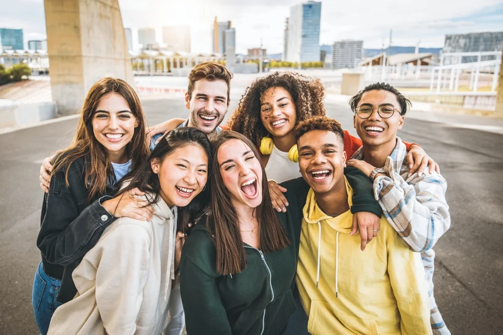 Group of young people having fun together outdoors in a city
