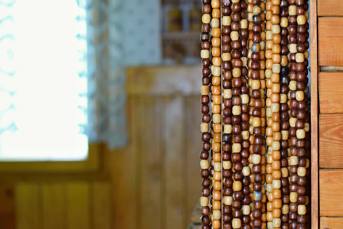 Old wooden curtain of beads in the kitchen