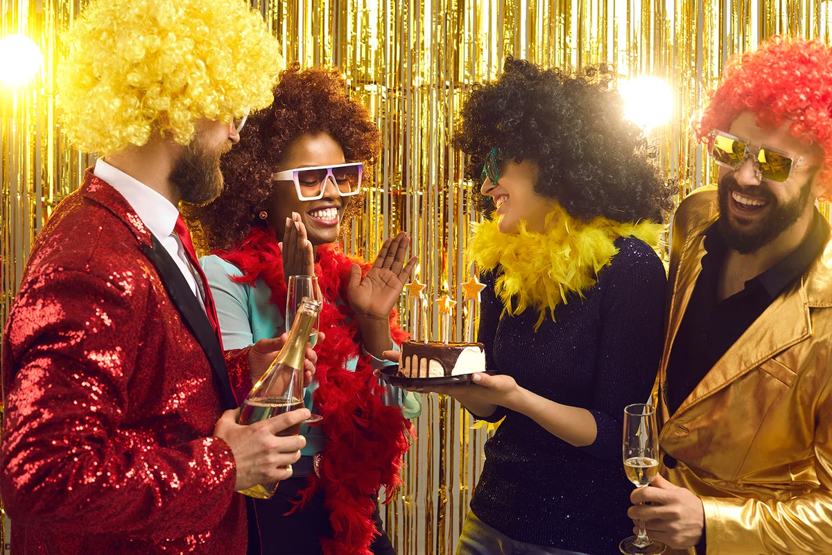 Group of happy friends in retro outfits