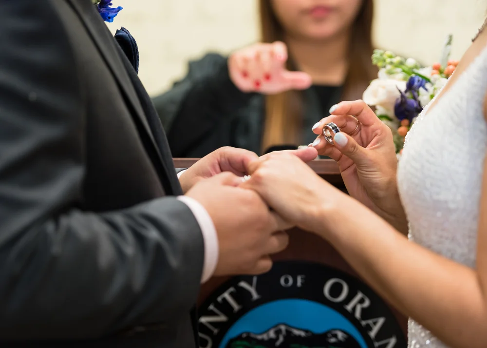 Close up of the bride and groom's hands during a courthouse wedding Ceremony