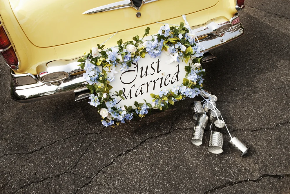 Beautiful just married sign on vintage car