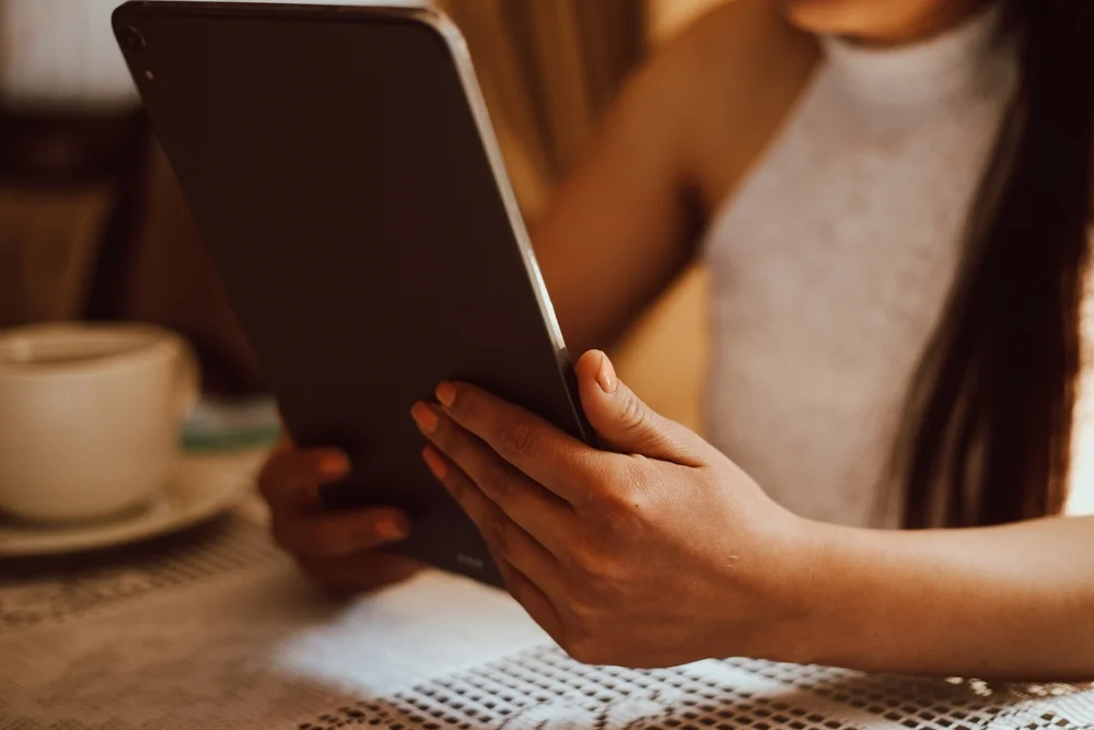 Close up of woman using her tablet