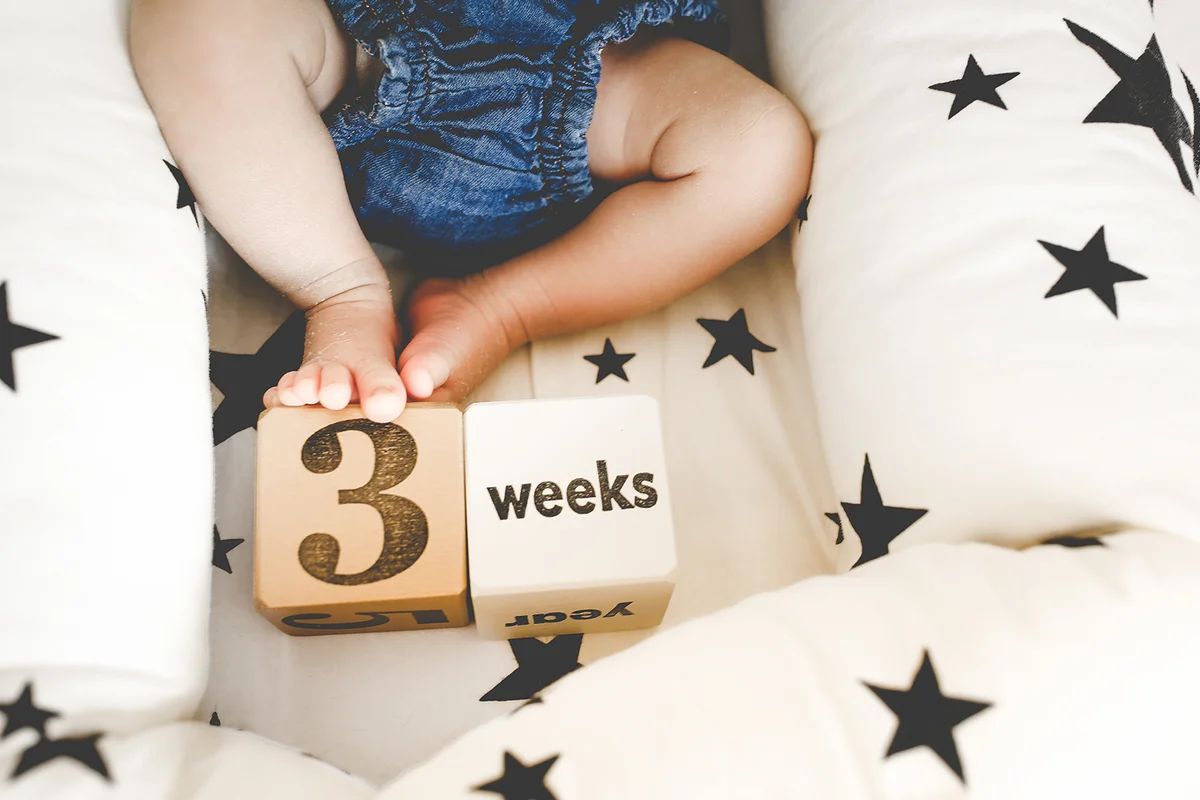 Cute infant legs wearing denim bottom