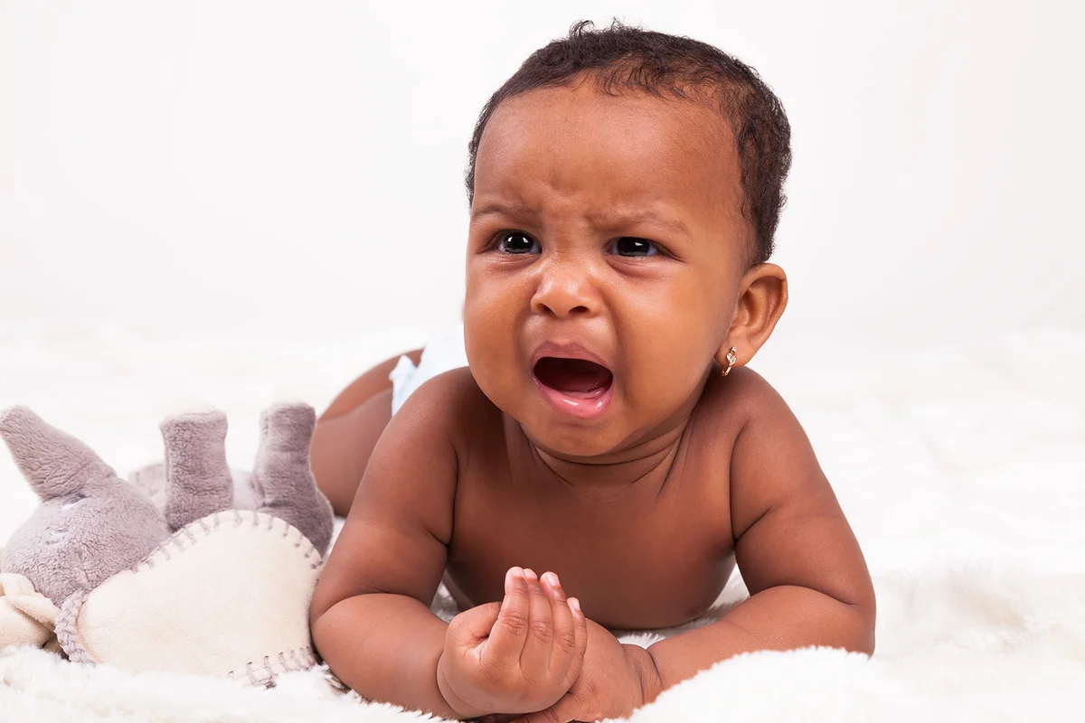 Adorable little african american baby girl crying