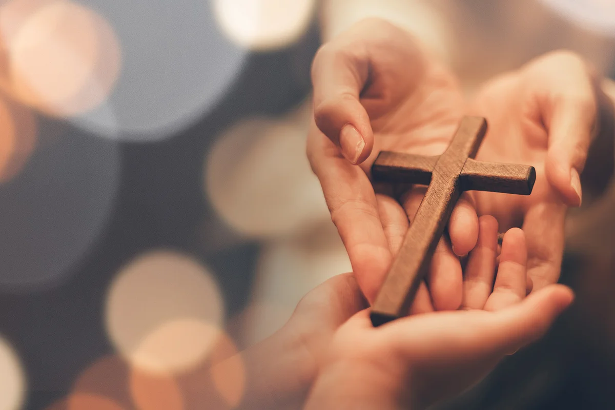Woman's hand with cross
