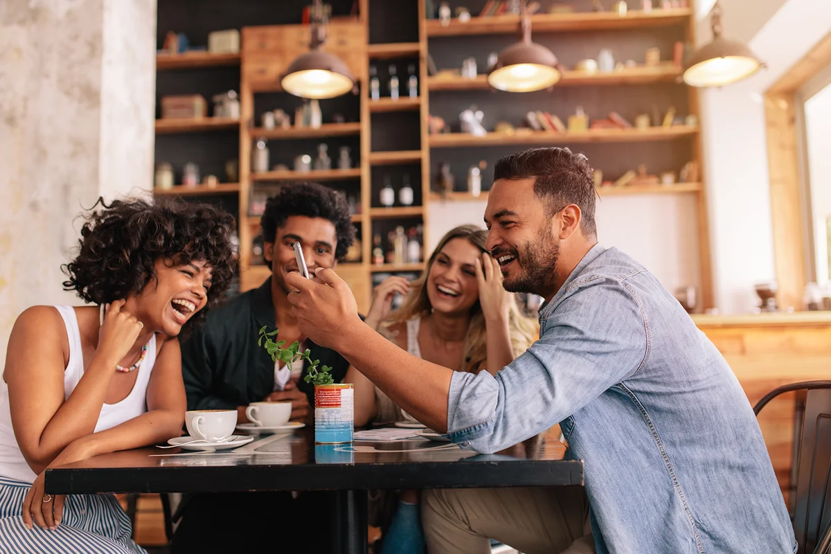 Young group of friends sitting in a cafe