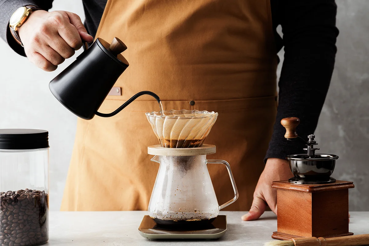 Men barista making a drip coffee