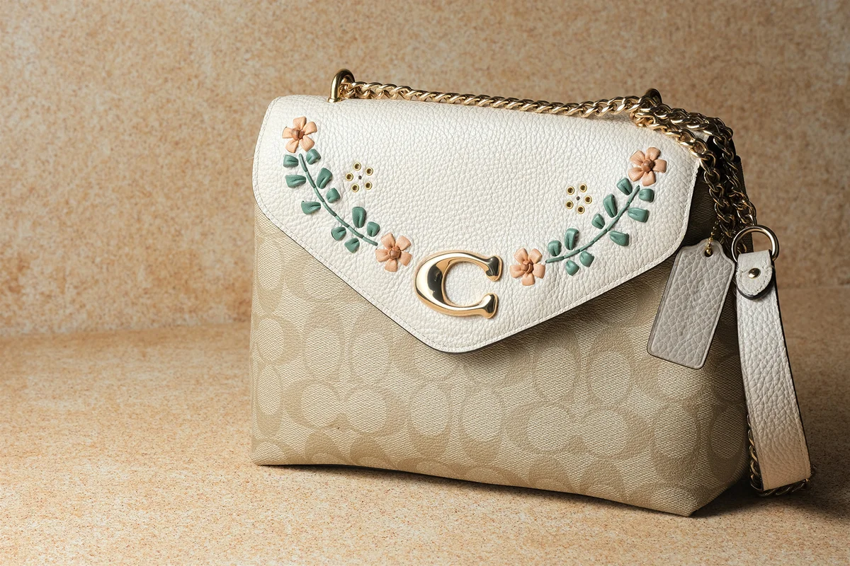 Woman hand bag on brown background