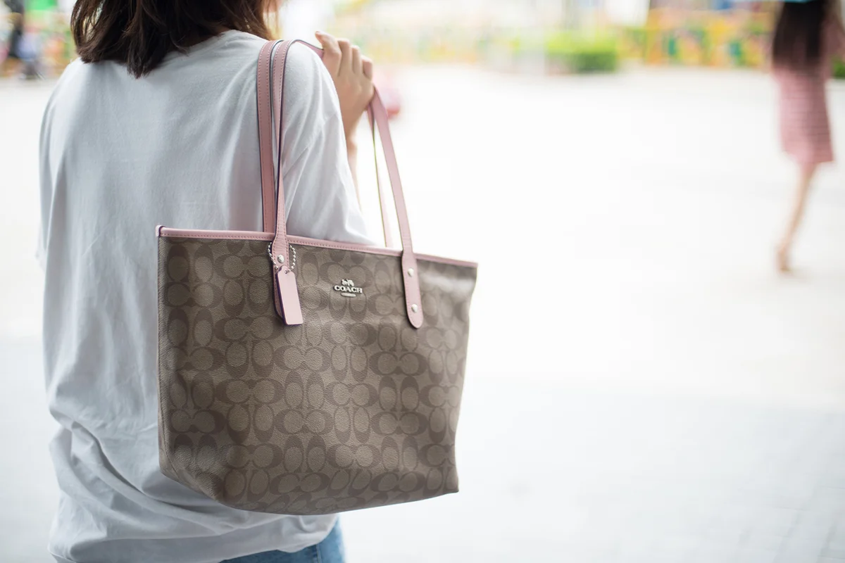 Woman with coach bag doing some shopping