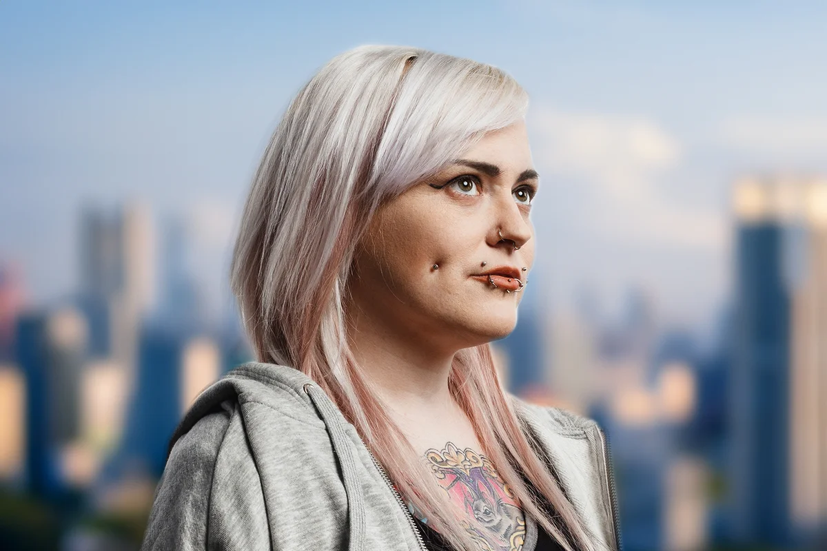 Woman with fashion piercing around her mouth and cheek