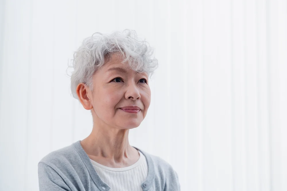 woman with a wavy pixie cut