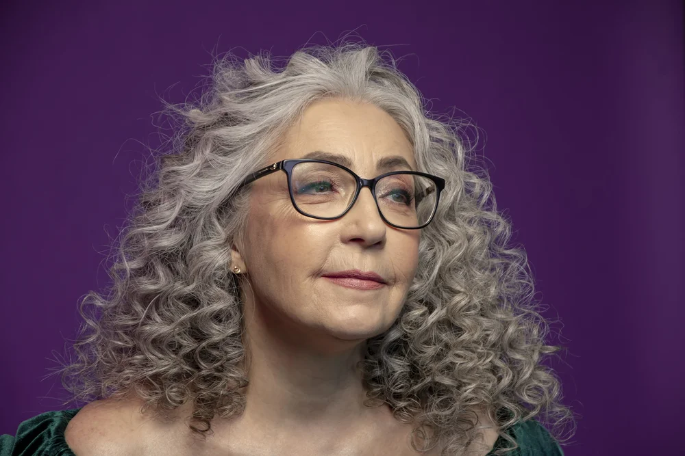 senior woman with long curly hair