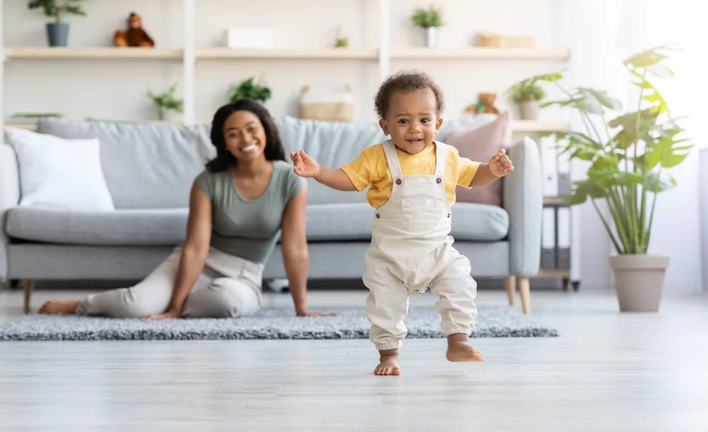 toddler taking first steps