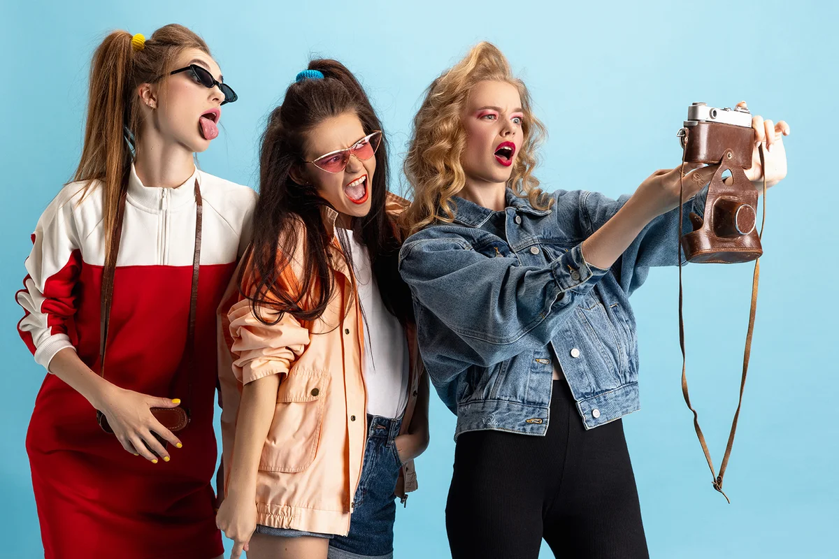 Pretty young women in retro 90s fashion style