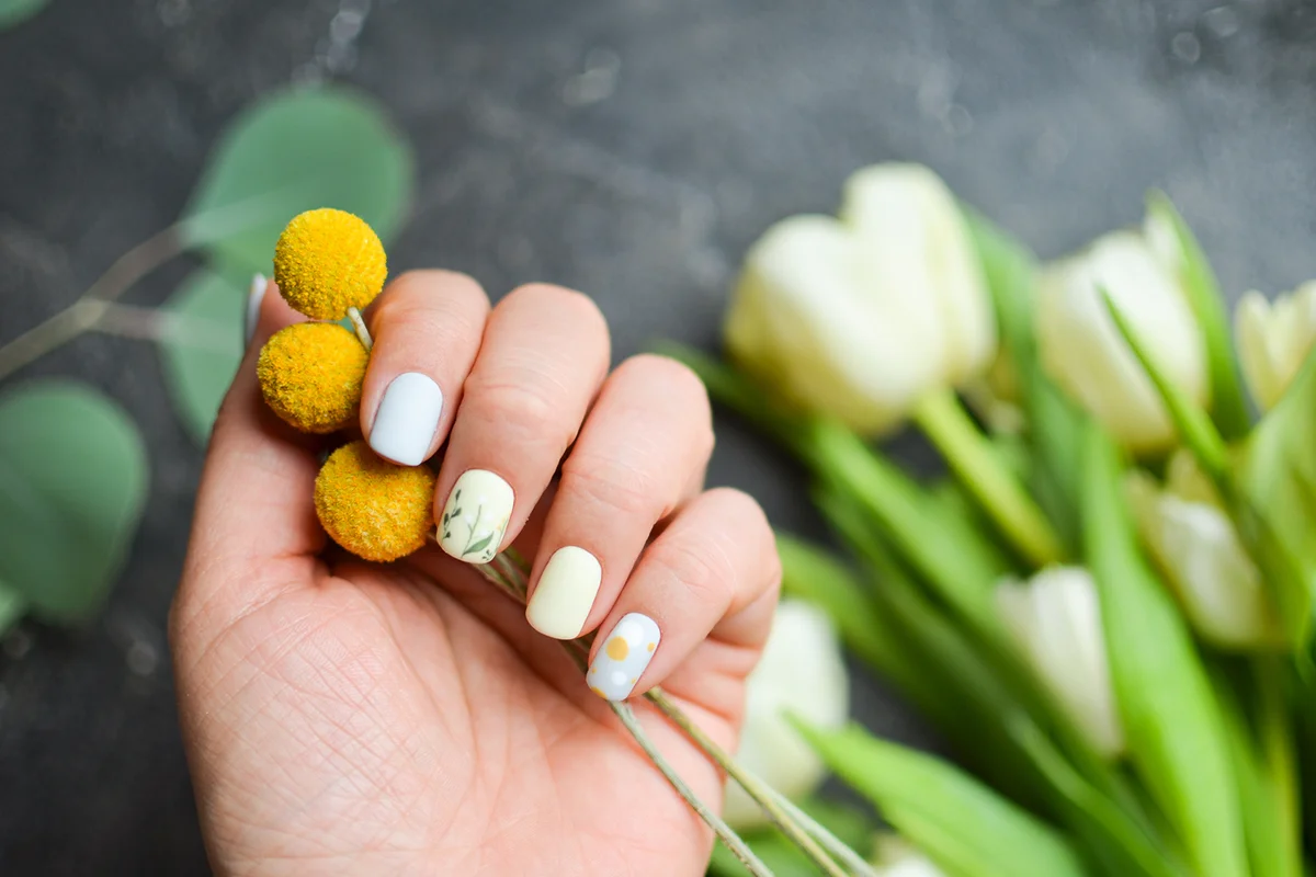Women's hands with colorful pattern on the nails
