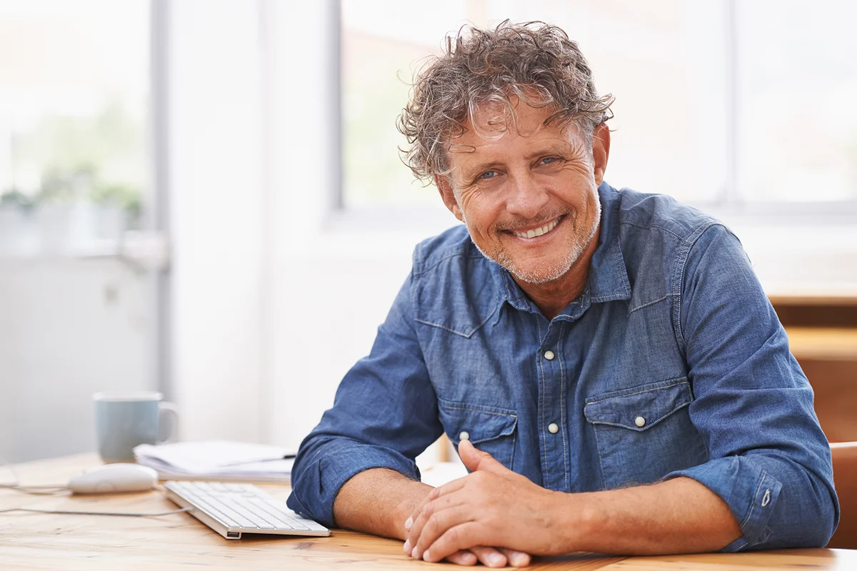 business man in office smiling