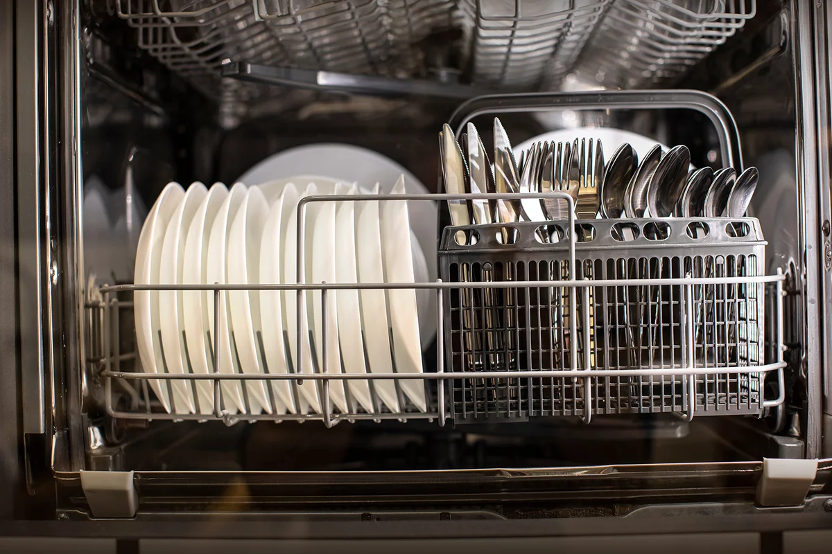 Clean transparent glass, plate, in dishwasher