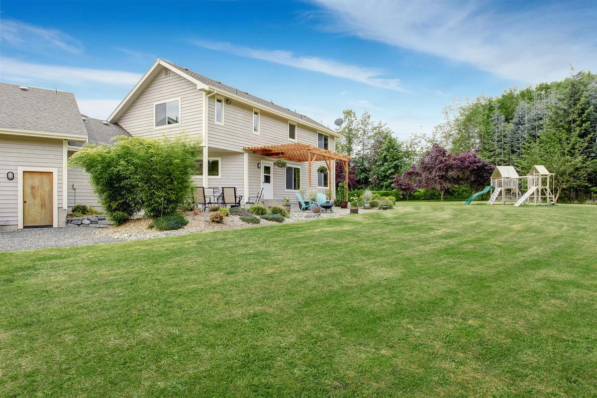 Beautiful house backyard with well kept lawn