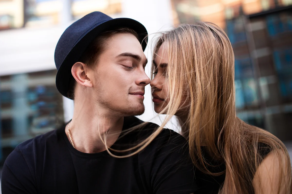 Couple dressed in black looking at each other,