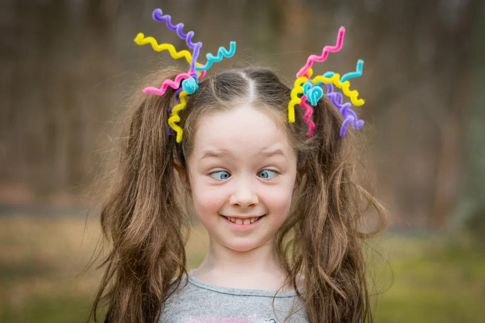 girl with pigtails and standout accessories