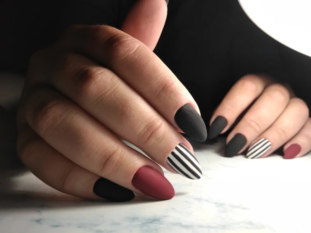 matte nails in black, white, and burgundy