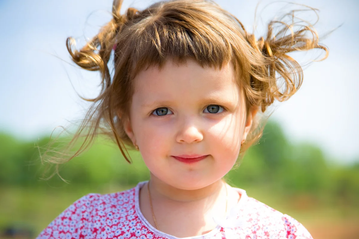 Portrait of cute disheveled Baby Girl looking to the camera
