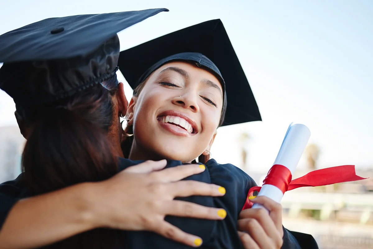 Education, graduation and success with students and hug with certificate for celebration