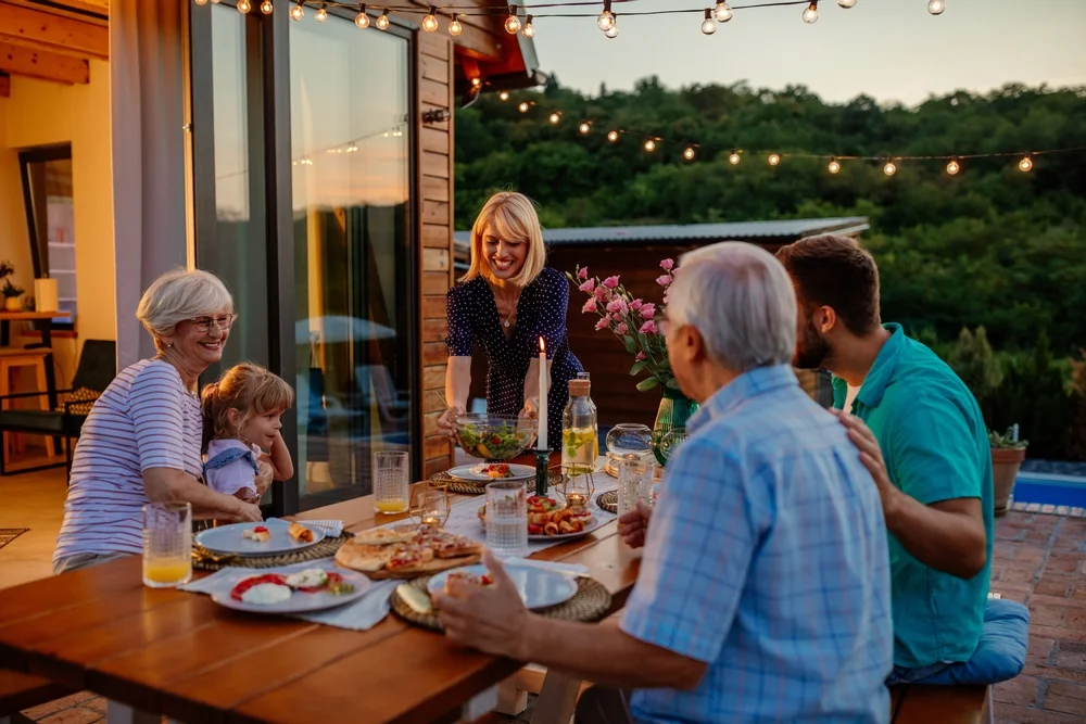 Family having dinner in a beautiful backyard