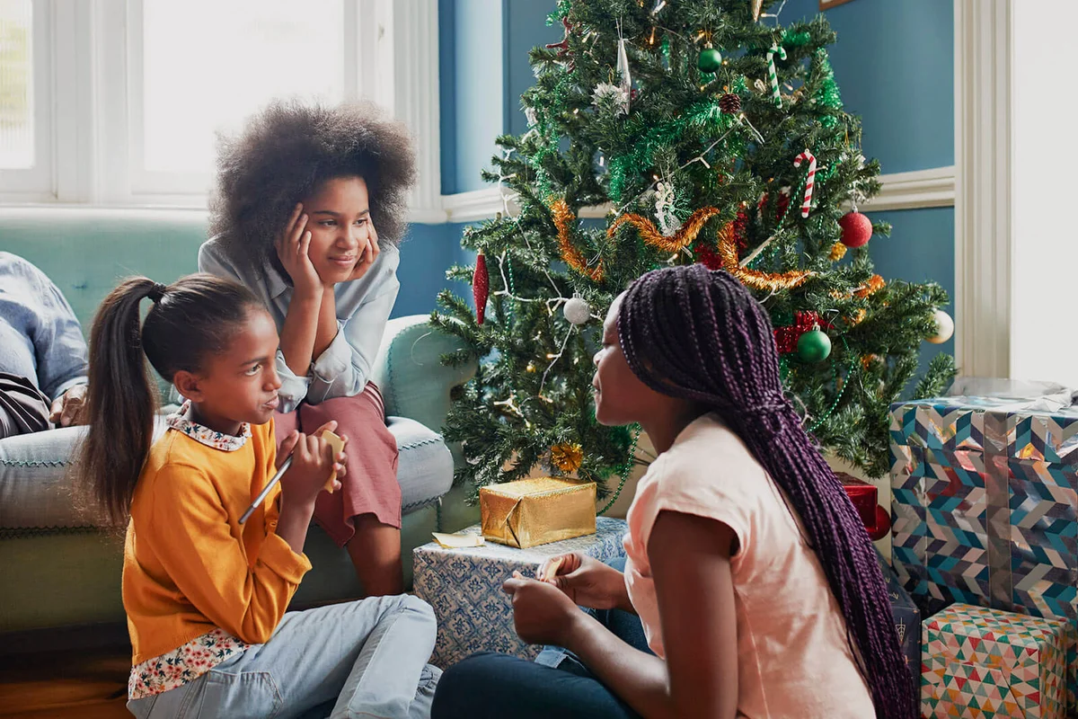 Sisters playing trivia games at Chrismas time