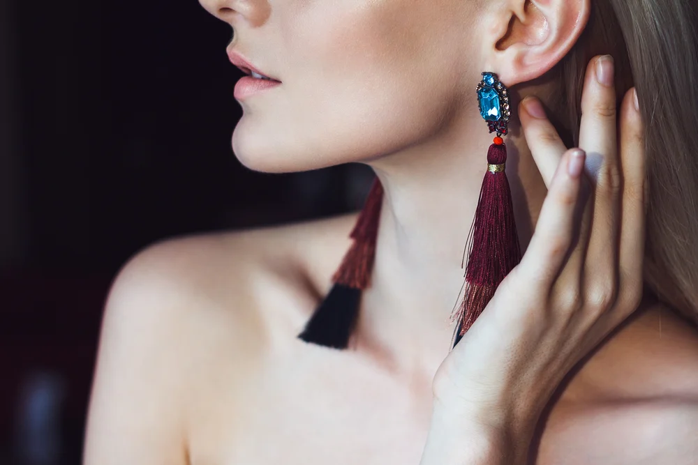 Close-up shot of a beautiful woman with long ethnic earrings