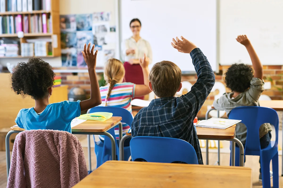 Education, question with group of children in classroom and raise their hands to answer.