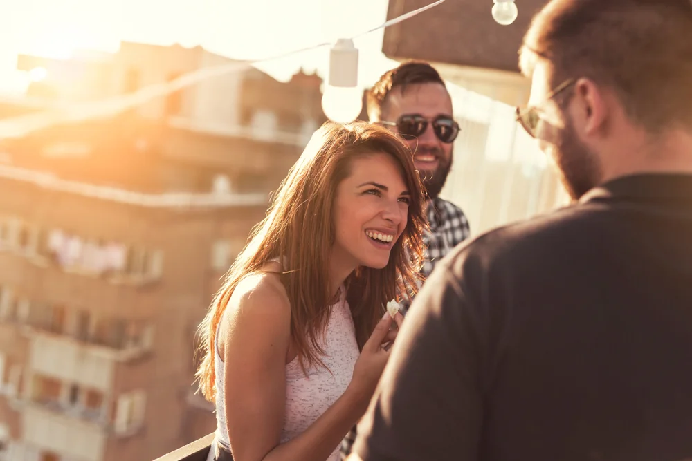 Friends hanging out on a rooftop party