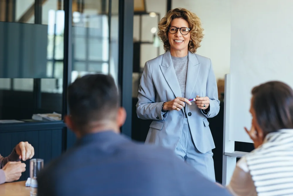 Woman presenting her ideas to her team in an office