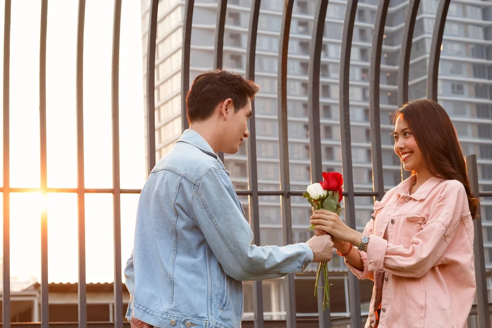 A Taurus man giving a woman flowers