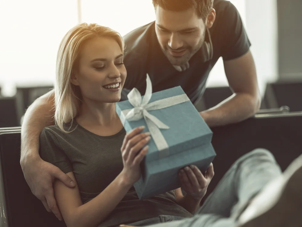 Taurus man giving a woman a gift