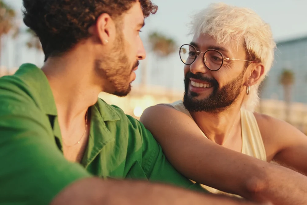 Taurus man giving a heart-warming smile to another man